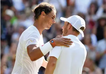  ?? Picture: GERRY PENNY, EPA ?? BETTER LUCK NEXT TIME: Rafael Nadal at the net with Dudi Sela whom he defeated in their first-round match at Wimbledon yesterday.