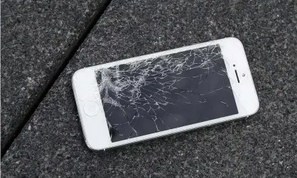  ?? Photograph: Ben Margot/AP ?? Let’s keep dancing on the broken glass: an iPhone in need of repair.