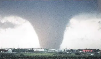  ?? STEVE SIMON/FILES ?? The 1987 Edmonton tornado created a path of devastatio­n that killed 27 people and injured 600 more. As with many weather disasters on the Prairies, so many people wanted to pitch in with the recovery efforts that thousands of volunteers couldn’t be...