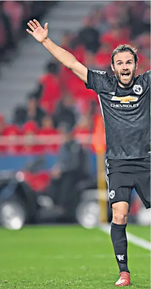  ??  ?? Fine margins: Juan Mata appeals for a goal as Benfica goalkeeper Mile Svilar (left) fails to stop the ball crossing the line; Romelu Lukaku (right) consoles compatriot Svilar at the final whistle