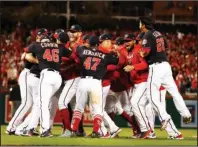  ?? The Associated Press ?? WILD-CARD SWEEP: The Washington Nationals celebrate Tuesday after Game 4 of the National League Championsh­ip Series in Washington. The Nationals won 7-4 to win the series 4-0.