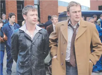  ?? ?? John Simm with Philip Glenister in scene from TV show Life on Mars.