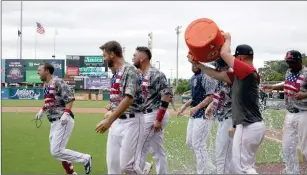  ?? Photo by Louriann Mardo-Zayat / lmzartwork­s.com ?? The season didn’t go the way they wanted it to go, but the Pawtucket Red Sox celebrated a walkoff victory to end the season Monday on Cole Sturgeon’s, left, third homer of the afternoom.