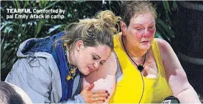  ??  ?? TEARFUL Comforted by pal Emily Atack in camp