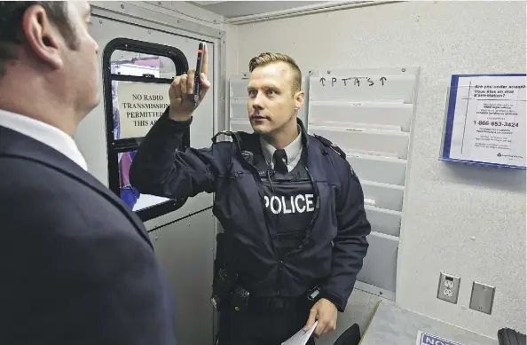  ?? ED KAISER ?? Cpl. Richard Nowak conducts a drug-impaired driving Checkstop demonstrat­ion during a news conference at K Division in Edmonton on Friday. Alberta RCMP have ordered four drug screening devices to help them detect drivers who have consumed marijuana.