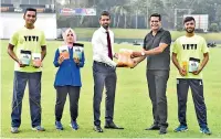  ?? ?? Director, Yeti Dr. Dilshan Balasuriya (third from left) handing over a pack of Yeti products to President, SLS Suren Kohombange in the presence of Ravindu Laksiri, Fathoum Issadeen and Shamil Wakeel