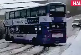  ??  ?? Double trouble: A bus slews across icy road in West Yorkshire