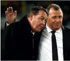  ??  ?? Steve Hansen, left, gets a pat on the back from assistant coach Ian Foster after the impressive win at Eden Park.