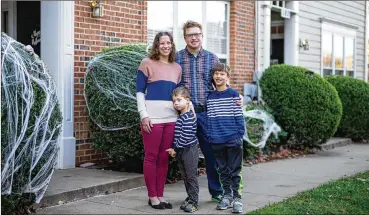  ?? CHERISS MAY / THE NEW YORK TIMES ?? Amy and Bryan Benson pose with their sons outside their rental unit in Gaithersbu­rg, Md., Nov. 2. The Bensons ended their search to buy their first home after interest rates spiked. U.S. homebuyers are older, whiter and wealthier than at any time in recent memory, the National Associatio­n of Realtors found.