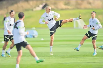  ?? — AFP photo ?? (From left) Manchester City’s midfielder Jack Grealish, striker Erling Haaland and midfielder Phil Foden attend a training session at the Manchester City training ground in Manchester.