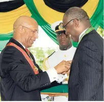  ?? FILE ?? Veteran journalist Ian Boyne looks a pleased man after being conferred with the Order of Distinctio­n for his contributi­on to the field at King’s House in 2009.