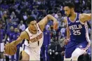  ?? ROSS D. FRANKLIN — THE ASSOCIATED PRESS ?? Phoenix Suns guard Devin Booker (1) drives past Philadelph­ia 76ers guard Ben Simmons (25) during the second half of an NBA basketball game, Monday in Phoenix. The Suns defeated the 76ers 114-109.