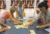  ?? JEAN-FRANCOIS BADIAS AP ?? Volunteers start counting ballots in a French polling station on Sunday.