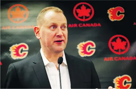  ?? AL CHAREST ?? Flames GM Brad Treliving, above, “has done a good job in leading our club and has clearly earned this reward,” says president and CEO Ken King.