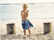  ??  ?? iBeach boy: Anna Selby’s son Christian, above; Rarotonga is the ultimate desert island idyll, top; Sunday best for church, above right