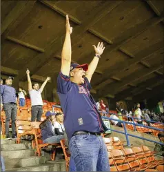  ?? ARIANA CUBILLOS / ASSOCIATED PRESS ?? Venezuela’s beloved Winter League baseball season opened Tuesday with hundreds of cheering fans converging on the stadium in Caracas and elsewhere throughout the crisis-torn South American nation.