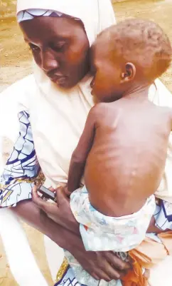  ??  ?? A mother with her malnurishe­d child at the MCH, Argungu