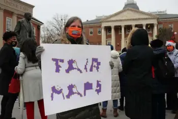  ?? Brian Witte, The Associated Press ?? Amanda Subbarao holds a sign calling for fair legislativ­e maps during a rally in December in Annapolis, Md.