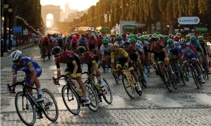  ??  ?? Egan Bernal in the leader’s yellow jersey amid the peleton on the Champs Élysées, on the verge of winning last year’s Tour de France. Photograph: Gonzalo Fuentes/Reuters
