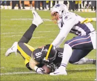  ?? Don Wright / Associated Press ?? Steelers tight end Jesse James (81) catches a pass then twists to stretch the ball into the end zone for a touchdown against the Patriots with seconds remaining in the fourth quarter of a game this past December. The play was overturned on review and the Patriots won.