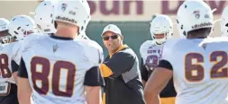  ?? CHERYL EVANS/THE REPUBLIC ?? Arizona State assistant coach Robert Rodriguez works with the defensive line during practice in Tempe on March 6.