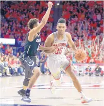  ?? RICK SCUTERI/ASSOCIATED PRESS ?? Arizona’s Allonzo Trier, right, has been declared ineligible for the reappearan­ce of a banned substance. The school is appealing the ruling.