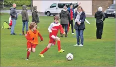  ?? 01_A03footy17 ?? An Arran player brings the ball out of defence.