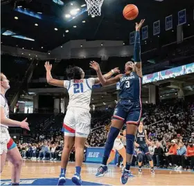  ?? Erin Hooley/Associated Press ?? G/F
UConn’s Aaliyah Edwards, right, makes a shot as DePaul guard Darrione Rogers defends on Saturday. 16.0