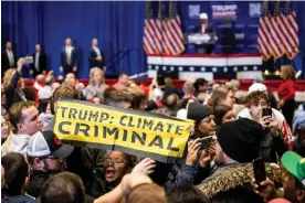  ?? ?? Climate protesters interrupt a Trump rally in Iowa on 14 January. Photograph: Christian Monterrosa/AFP via Getty Images