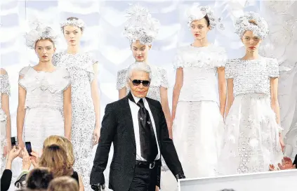  ?? PHOTO: REUTERS ?? Haute couture . . . Karl Lagerfeld appears at a Chanel fashion show in Paris in 2009.