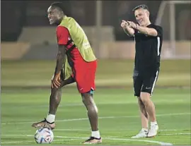  ?? Patrick T. Fallon AFP/Getty Images ?? CANADA COACH John Herdman, right, flanked by defender Richie Laryea, has been credited by his players for turning around the culture of the club.