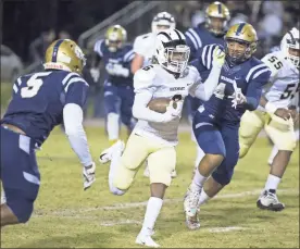  ?? / Special-Mike Adams ?? Rock mart’s Javin Whatley (6), center, rushes up field as Jefferson County defenders Jakoby Walters (5), left, and Kydran Jenkins (44) pursue at the high school football game between RockMart and Jefferson County in Louisville, GA. on Friday, November 23, 2018.