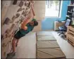  ?? DIMITRIS TOSIDIS / XINHUA ?? Climbing enthusiast Manthos Valsamidis keeps in practice at home.