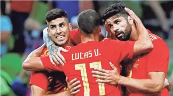  ?? JAVIER ETXEZARRET­A/EPA-EFE ?? Marco Asensio, left, Lucas Vazquez and Diego Costa plus Andres Iniesta, not pictured, play for Spain, which has world-class talent at every position.