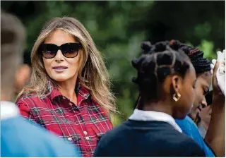  ?? WASHINGTON POST PHOTO BY MELINA MARA ?? Melania Trump at an event in the White House garden in September. The first lady has spoken relatively little during her first year but instead has presented a series of vivid images for photojourn­alists and social-media audiences.
