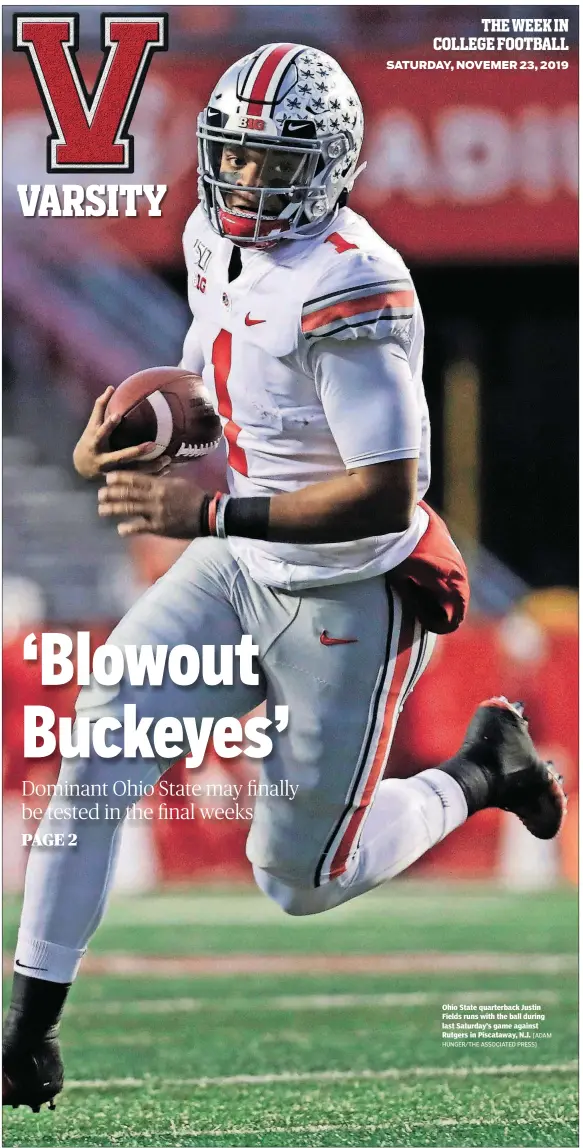  ?? [ADAM HUNGER/THE ASSOCIATED PRESS] ?? Ohio State quarterbac­k Justin Fields runs with the ball during last Saturday’s game against Rutgers in Piscataway, N.J.