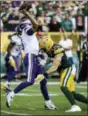  ?? MIKE ROEMER — THE ASSOCIATED PRESS FILE ?? Green Bay Packers’ Clay Matthews tackles Minnesota Vikings quarterbac­k Kirk Cousins during the second half of an NFL football game, in Green Bay, Wis. Matthews was penalized for roughing the passer on the play.