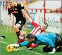  ??  ?? Accrington's Dean Winnard in action with Newport's Joe Day