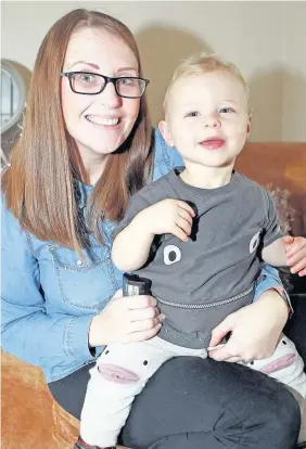  ?? David Powell ?? > Katie Davies, from Sychdyn in Flintshire, with her son Rusty Stubbs, aged 15 months