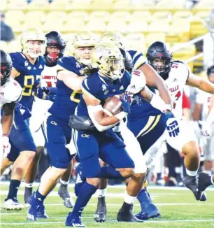  ?? AP PHOTO/ HYOSUB SHIN ?? Georgia Tech running back Jahmyr Gibbs breaks away for a touchdown against Louisville during the first half of last Friday’s game in Atlanta. Gibbs, a freshman who was starring for Dalton High School at this time last year, helped lead the Jackets to a 46-27 win over the Cardinals.