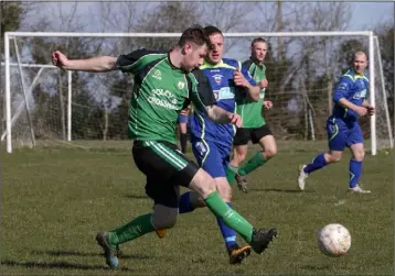  ??  ?? Mark Crosbie of Crossabeg is tracked by Gary Sinnott of New Ross Town.