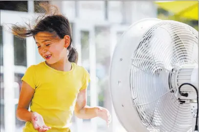  ?? Patrick Connolly ?? Las Vegas Review-journal @Pconnpie Adrianna Kostrzewa, 7, of Santa Barbra, Calif., cools off Tuesday with misters on the Strip as the temperatur­e reached 116.