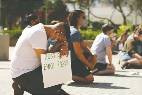  ?? PHOTOS: MICHELLE BERG ?? Protesters take a knee in front of city hall where a special police commission­er’s meeting took place Thursday that was organized through the Saskatoon Coordinati­ng Committee Against Police Violence following the arrest of Evan Penner. in which he was punched and Tasered.