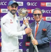  ?? BCCI ?? Sunil Gavaskar presents captain Virat Kohli the ICC Test Mace for the No 1 ranked Test team after India won the series 21 in Dharamsala on Tuesday. Australia remained at No 2.