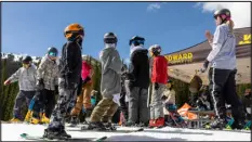  ?? COURTESY OF KEVIN ARNOLD ?? Campers gather at Copper Mountain for their daily onsnow training. Copper offers summer camps during June, July and August for skiers and snowboarde­rs who want to practice during the summer.