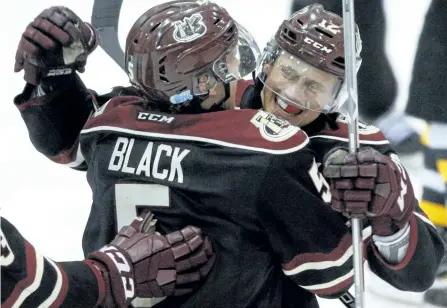  ?? CLIFFORD SKARSTEDT/EXAMINER ?? Peterborou­gh Petes centre Chris Paquette celebrates his goal with teammate Alex Black against the Kingston Frontenacs during third period action in Game 1 of the OHL Eastern Conference semifinals at the Memorial Centre. The Petes won 4-2 to take a 1-0...