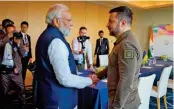  ?? (AFP) ?? Ukraine’s President Volodymyr Zelensky shaking hands with India’s PM Narendra Modi in Hiroshima, on Saturday