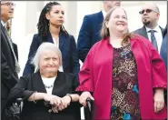  ?? AP/SUSAN WALSH ?? Aimee Stephens (front left), a transgende­r woman who was fired from her job as a funeral home director, and her wife, Donna Stephens, attend a news conference Tuesday outside the Supreme Court in Washington.