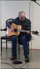  ?? CHAD FELTON — THE NEWSHERALD ?? Marc Yanko, of Chardon, jams during an open mic session on Feb. 22at the Lake Erie Folk Fest. The event is in its fifth year.