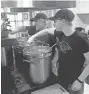  ??  ?? Steve Cybulski, left, and Janna Kupper stir mustard at Blackwater Mustard Company in Contoocook, N.H. NICK STOICO/THE CONCORD MONITOR VIA AP